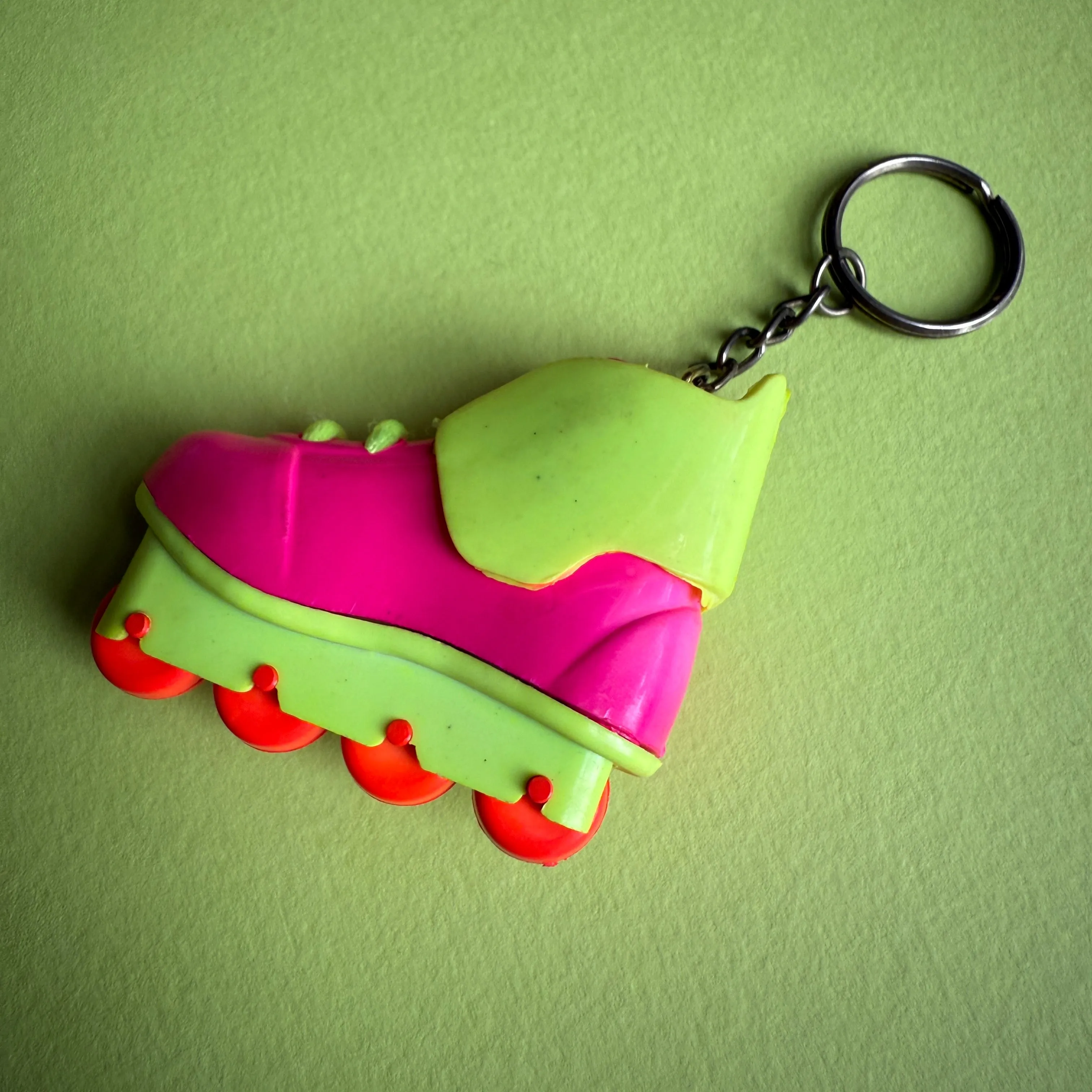 Neon 80s pink rollerblade charm